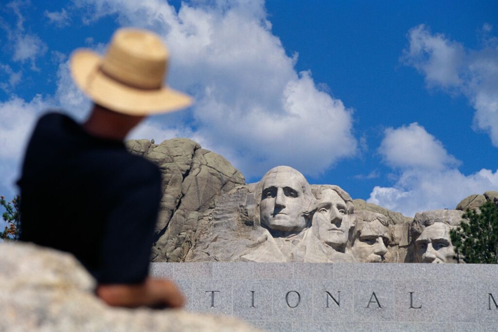 Man looking at Mount Rushmore